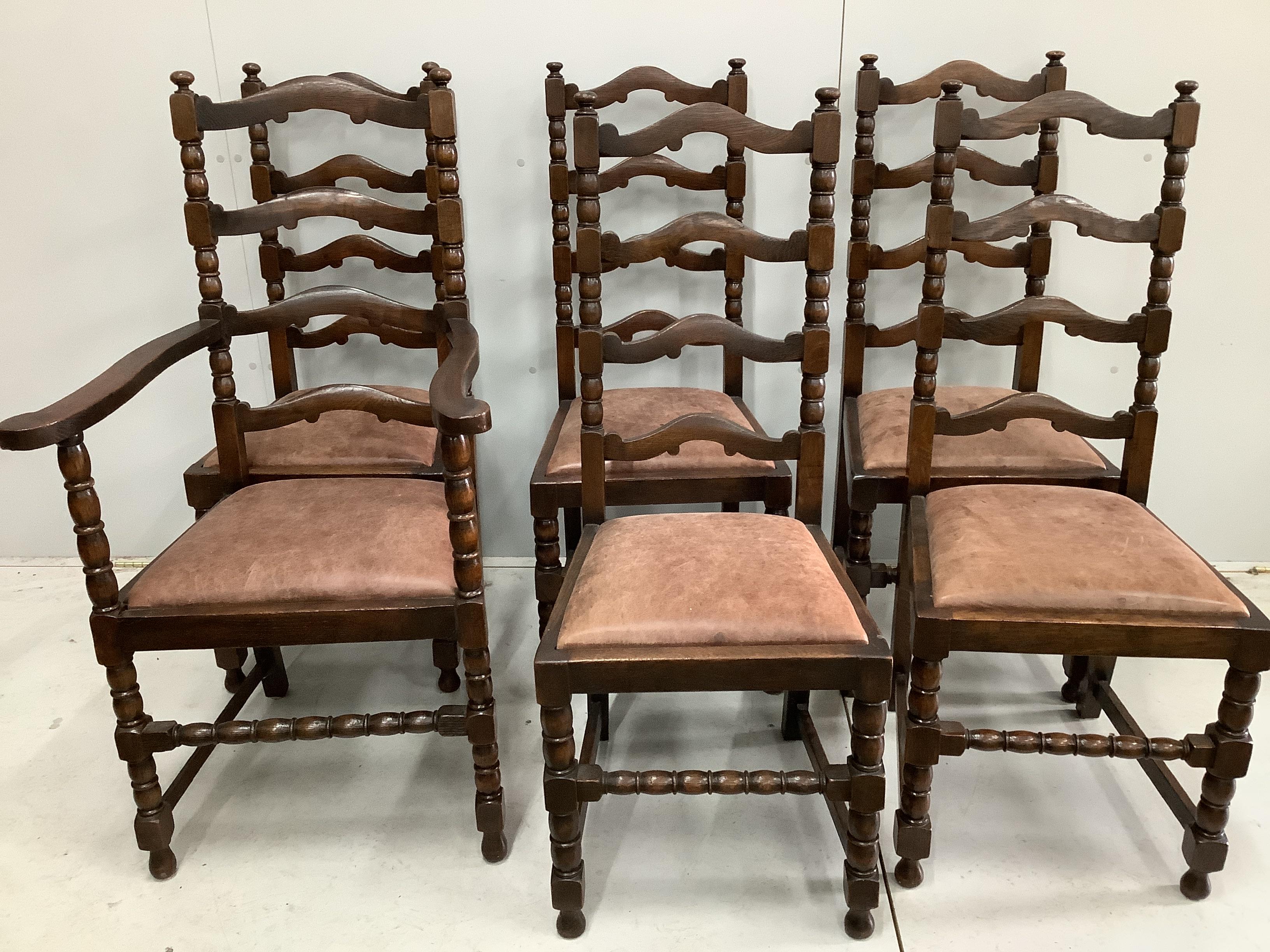 An 18th century style oak gateleg dining table, 170cm extended, depth 122cm, height 75cm together with a set of six oak ladderback dining chairs (one with arms)